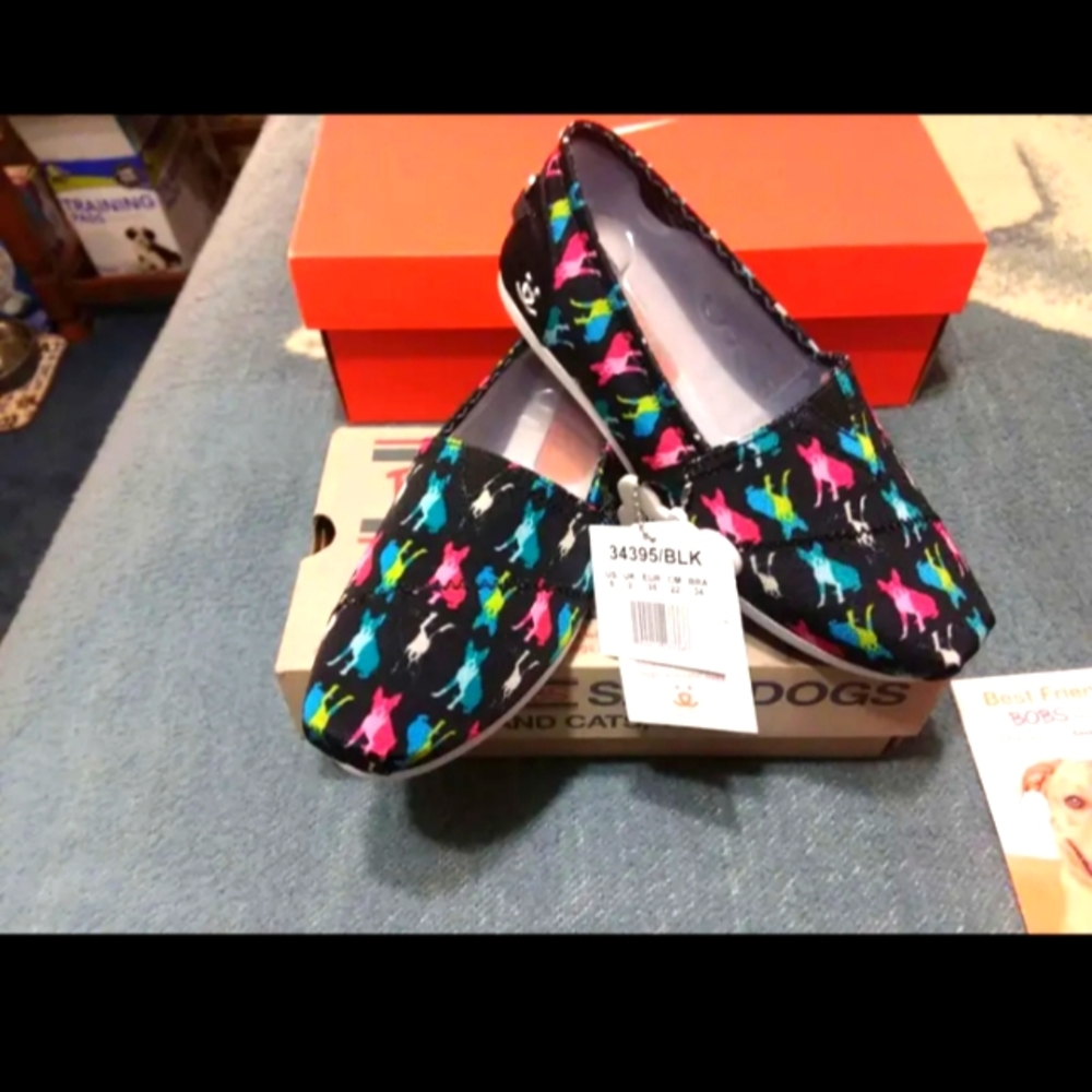 COPY - Size 9 Skechers Bobs multi-colored puppies and dogs on a black sneaker.